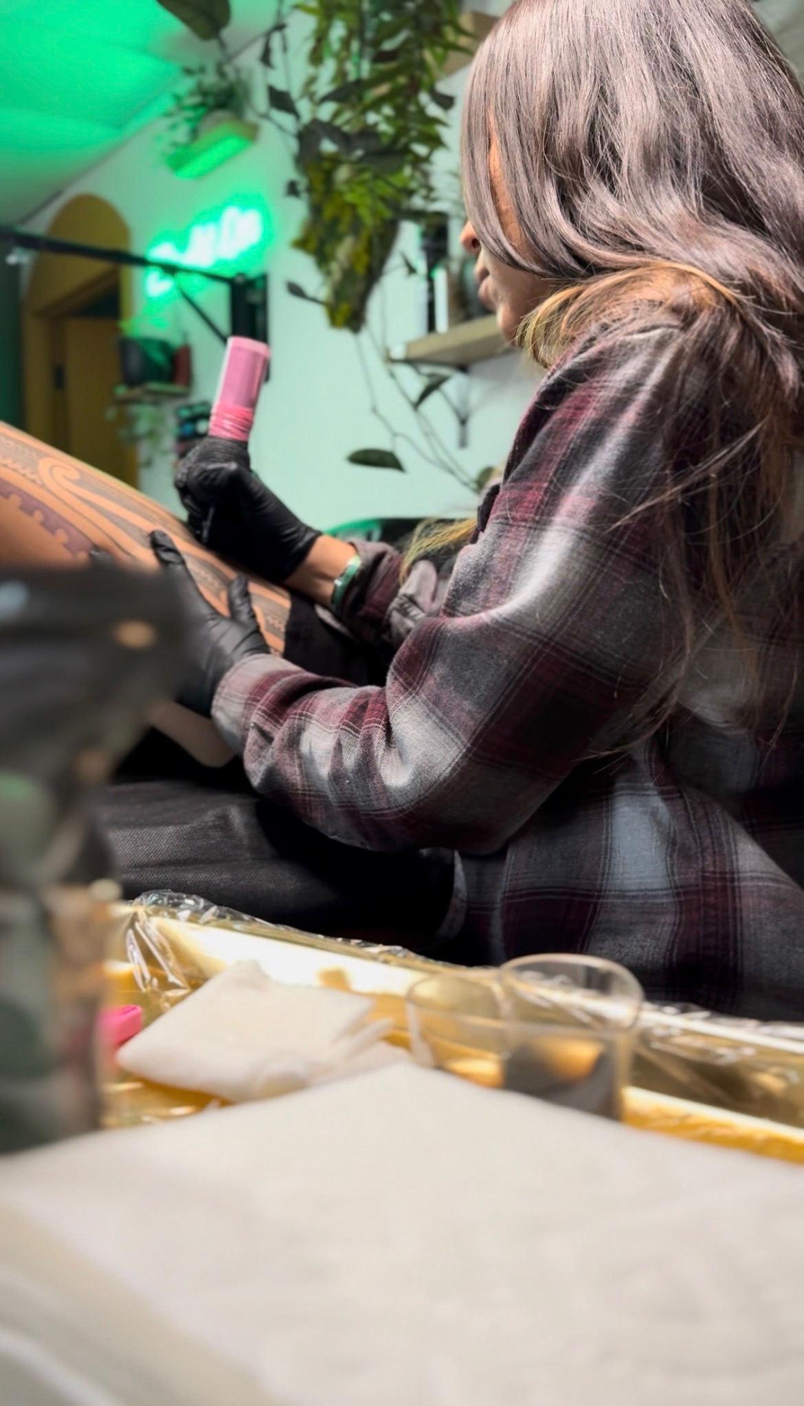 Jen working on a tattoo