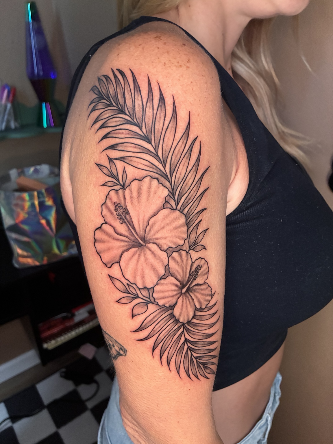 Fine-line floral tattoo by Jen