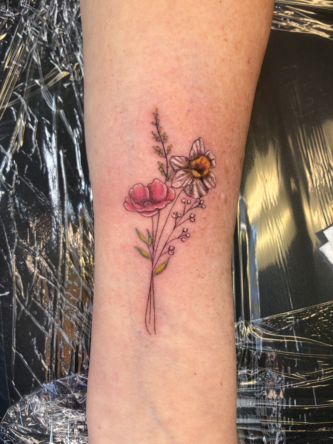 Small color floral tattoo by Jen