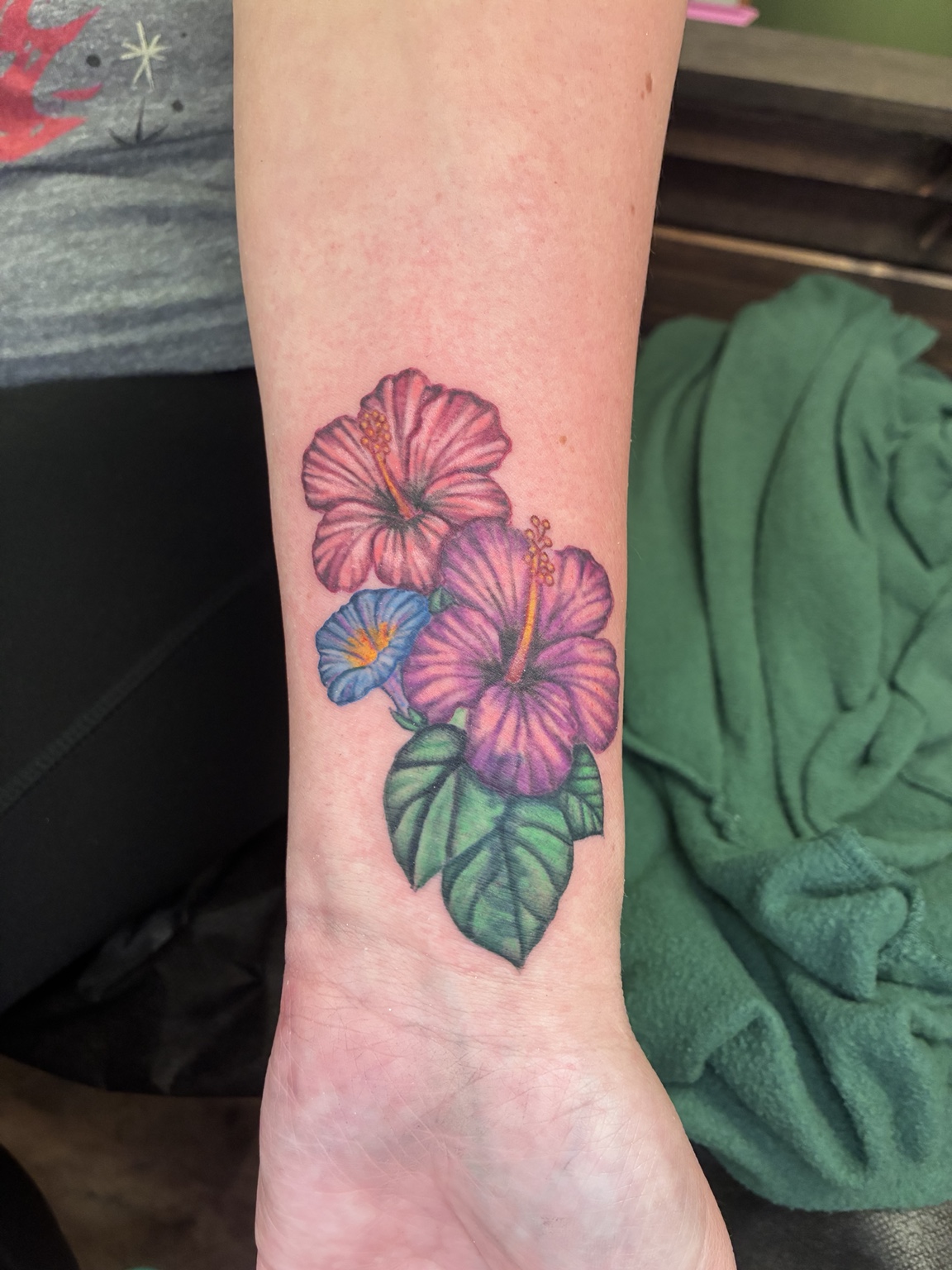 Color hibiscus tattoo by Jen