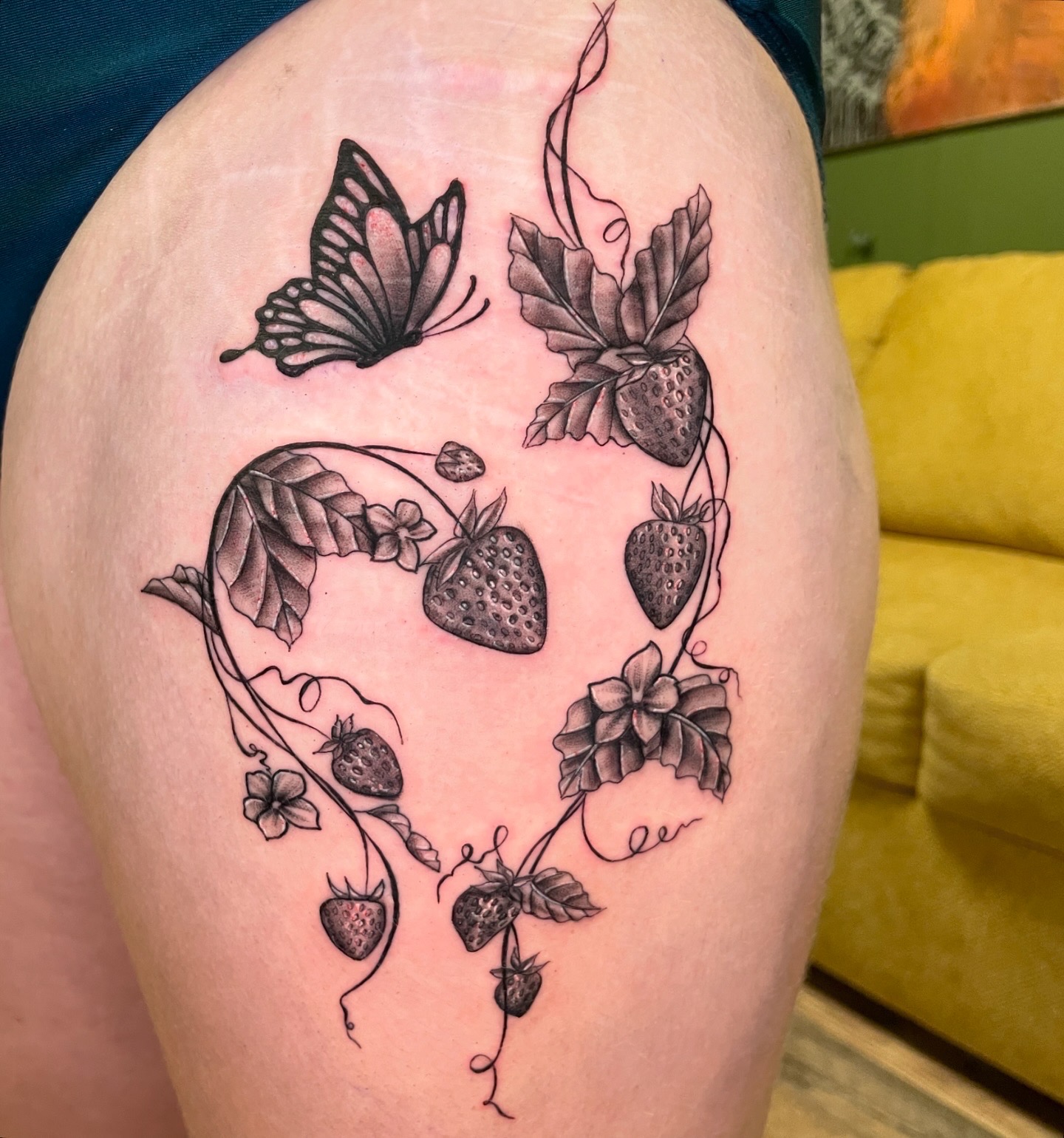 Fine-line botanical tattoo by Jen