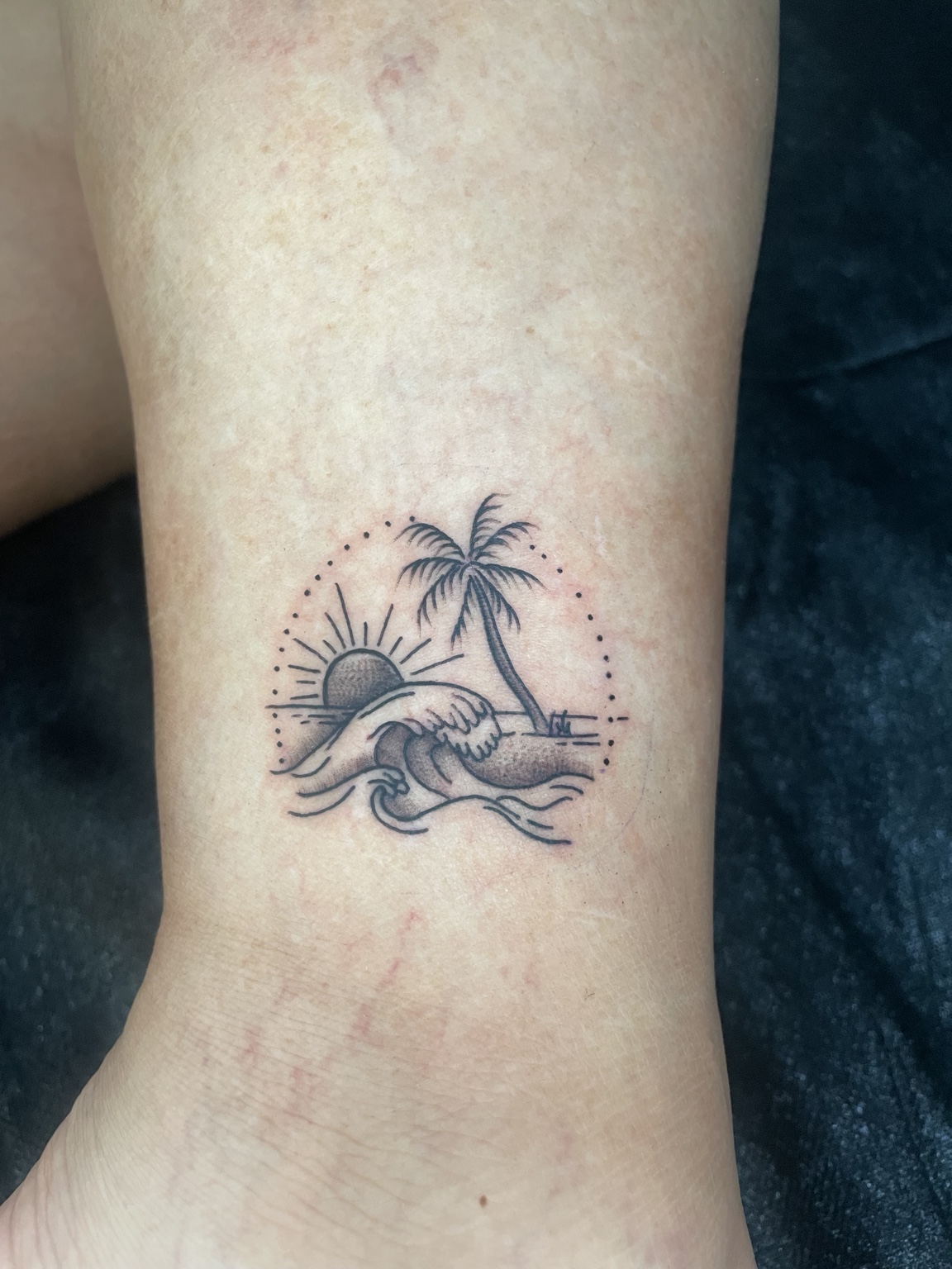 Fine-line ocean scene tattoo by Jen