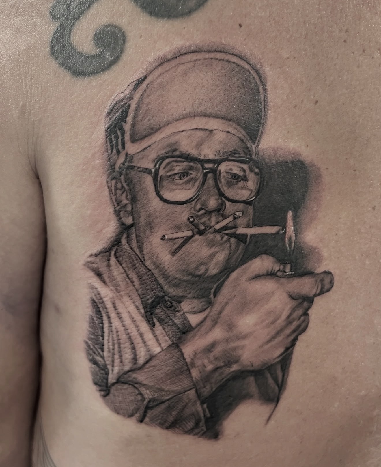 Black-and-gray portrait tattoo by Kai