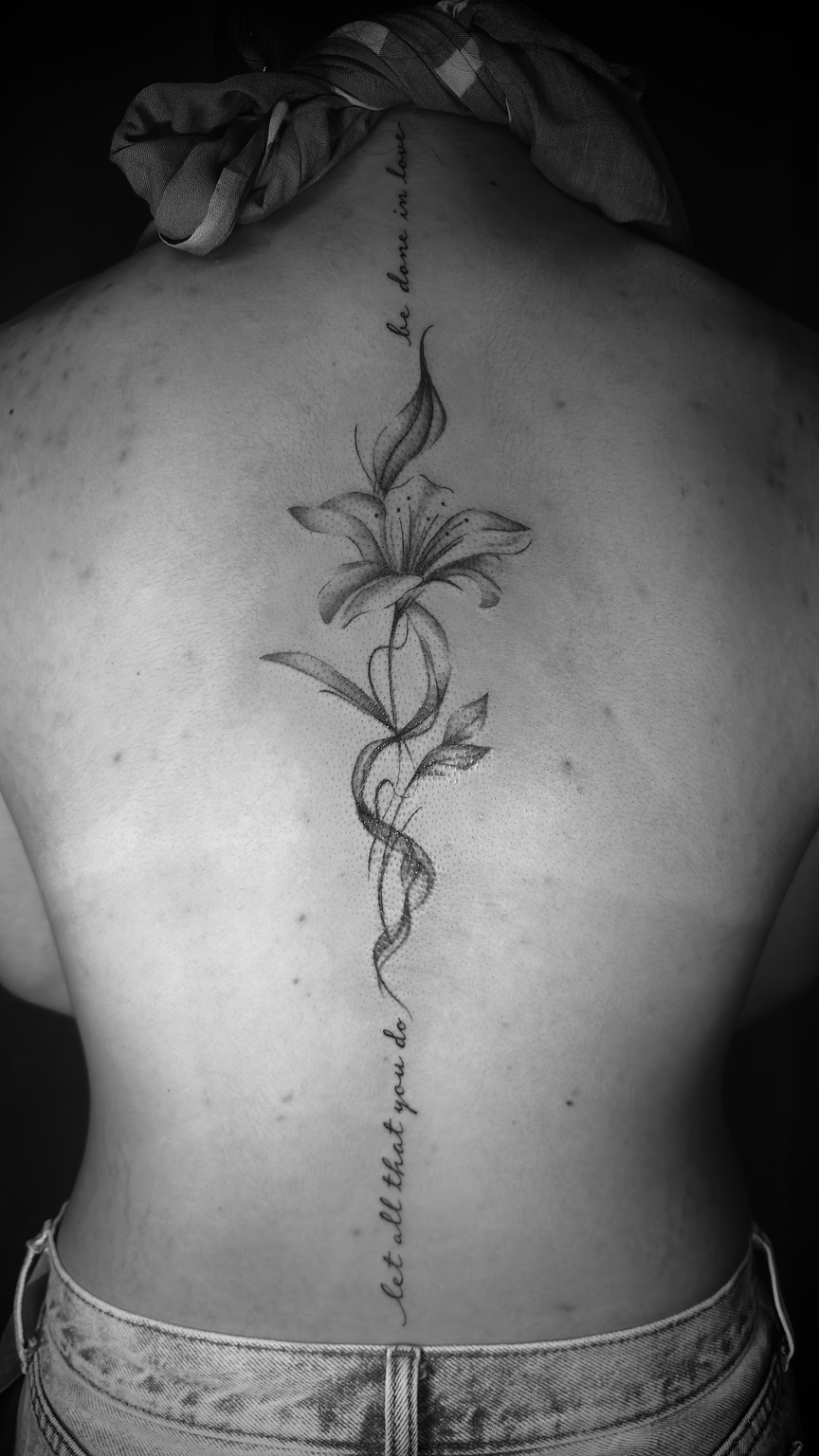 Delicate floral tattoo by Kai